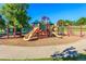Vibrant community playground featuring multiple slides and climbing structures at 7030 S Fillmore Ct, Centennial, CO 80122