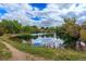Picturesque community pond surrounded by trees and natural landscape at 7030 S Fillmore Ct, Centennial, CO 80122