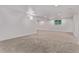 Open basement features carpet, recessed lighting, and a small window at 8696 W 86Th Cir, Arvada, CO 80005