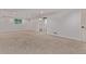 Spacious carpeted basement with white walls, recessed lighting, and natural light at 8696 W 86Th Cir, Arvada, CO 80005