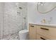 Bathroom featuring marble and stone tiled shower and modern vanity at 8696 W 86Th Cir, Arvada, CO 80005