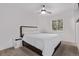 Bedroom with a queen bed, ceiling fan, and a large window at 8696 W 86Th Cir, Arvada, CO 80005