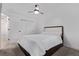 Bedroom featuring a queen bed, double closets, and a ceiling fan at 8696 W 86Th Cir, Arvada, CO 80005