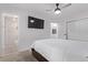 Bedroom with an ensuite bathroom featuring marble accents and glass shower at 8696 W 86Th Cir, Arvada, CO 80005