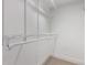 Walk-in closet features white shelving, closet rod, and carpet at 8696 W 86Th Cir, Arvada, CO 80005