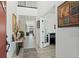 Bright entryway featuring a high ceiling, wood floors, and elegant decor at 6454 Leathers Ln, Parker, CO 80134