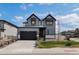 Charming two-story home with a well-manicured lawn and a spacious two-car garage at 6454 Leathers Ln, Parker, CO 80134