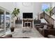 Inviting living room featuring a fireplace, comfortable seating, and an abundance of natural light at 6454 Leathers Ln, Parker, CO 80134