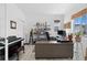 Home office with a large desk, neutral decor, lots of light and a musical instrument at 6454 Leathers Ln, Parker, CO 80134