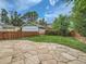 Fenced backyard with a stone patio and grassy area, perfect for outdoor entertaining at 1615 Osceola St, Denver, CO 80204