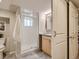 Bathroom featuring a glass-enclosed shower, tiled floors, and a modern vanity at 1615 Osceola St, Denver, CO 80204
