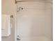 A bright bathtub and shower area that is ready for your own touches at 1615 Osceola St, Denver, CO 80204