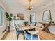 Bright dining room features an elegant chandelier, wood floors, and a stylish dining set at 1615 Osceola St, Denver, CO 80204