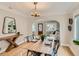 The dining room is adjacent to the living room and has a stylish table set for a meal at 1615 Osceola St, Denver, CO 80204