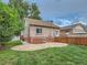 Brick home with well maintained backyard, patio, and private fence at 1615 Osceola St, Denver, CO 80204