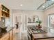 Kitchen view featuring dark countertops, stainless steel gas stovetop, and access to adjacent rooms at 1615 Osceola St, Denver, CO 80204