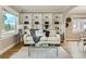 Bright living room featuring custom built-ins, hardwood floors, and stylish decor at 1615 Osceola St, Denver, CO 80204