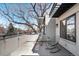 Spacious balcony with comfortable seating, modern railings, and a view of a large tree and blue sky at 1688 S Grant St, Denver, CO 80210
