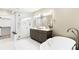 A bathroom with a glass shower and double vanity at 1688 S Grant St, Denver, CO 80210