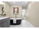 Well lit bathroom with a black soaking tub and modern vanity at 1688 S Grant St, Denver, CO 80210