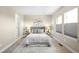 A bedroom features soft gray tones and a neutral area rug at 1688 S Grant St, Denver, CO 80210