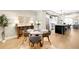 Open-concept dining area with modern furnishings, hardwood floors, and natural light at 1688 S Grant St, Denver, CO 80210