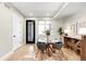 Inviting dining area with a glass table, comfortable seating, and elegant lighting at 1688 S Grant St, Denver, CO 80210
