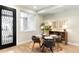 Bright dining room with modern decor, a glass-top table, and stylish chairs at 1688 S Grant St, Denver, CO 80210