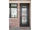 Close-up of an ornate front door with decorative ironwork and modern hardware at 1688 S Grant St, Denver, CO 80210