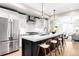 Contemporary kitchen with a large island, stylish seating, and stainless steel appliances at 1688 S Grant St, Denver, CO 80210