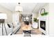 Open concept living room flowing into a modern kitchen with ample seating and natural light at 1688 S Grant St, Denver, CO 80210