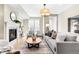 Inviting living room with fireplace, stylish furnishings, and plenty of natural light at 1688 S Grant St, Denver, CO 80210