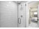 Modern shower featuring white subway tile, glass enclosure, and a sleek shower head and handle set at 1688 S Grant St, Denver, CO 80210
