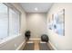 Tranquil yoga room with a large window, minimalist decor, and hardwood floors, perfect for exercise and relaxation at 1688 S Grant St, Denver, CO 80210