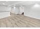 Spacious basement with neutral carpet, white walls, and access to stairs at 3932 S Quatar St, Aurora, CO 80018