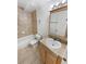 Bathroom featuring a tile tub-shower combination, toilet, and vanity at 3932 S Quatar St, Aurora, CO 80018