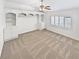 Bedroom featuring built-in shelving, a ceiling fan, neutral carpet, and plantation shutters at 3932 S Quatar St, Aurora, CO 80018