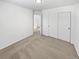 This bedroom features neutral carpet, closet with double doors, and an entryway at 3932 S Quatar St, Aurora, CO 80018