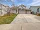 Charming two-story home featuring a three-car garage and inviting front porch at 3932 S Quatar St, Aurora, CO 80018