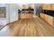 Eat-in kitchen featuring wood cabinets, black countertops, and stainless steel appliances at 3932 S Quatar St, Aurora, CO 80018