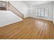 Unfurnished living room featuring light wood floors, neutral paint, and plenty of natural light at 3932 S Quatar St, Aurora, CO 80018