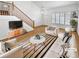 Bright living room showcasing a staircase, natural light, neutral paint, and tasteful decor at 3932 S Quatar St, Aurora, CO 80018