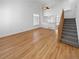 Bright living room featuring hardwood floors, vaulted ceilings, and plantation shutters at 3932 S Quatar St, Aurora, CO 80018