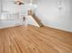 Spacious living room featuring a high ceiling, hardwood floors, and a staircase at 3932 S Quatar St, Aurora, CO 80018
