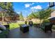 Inviting backyard with outdoor seating, a fire pit, lush lawn, and mature landscaping for relaxing or entertaining at 1113 Southbury Pl, Highlands Ranch, CO 80129