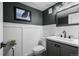 Charming powder bathroom with shiplap walls, a modern vanity, and a framed art print at 1113 Southbury Pl, Highlands Ranch, CO 80129