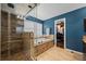 Beautiful bathroom with a walk-in shower, soaking tub, and access to a walk-in closet, creating a luxurious retreat at 1113 Southbury Pl, Highlands Ranch, CO 80129