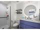 Contemporary bathroom featuring a stand-up shower, floating shelves, and unique lighting at 1113 Southbury Pl, Highlands Ranch, CO 80129