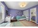 Charming bedroom with a star-themed decor, desk, and cozy bed at 1113 Southbury Pl, Highlands Ranch, CO 80129