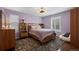 Comfortable bedroom with a queen-sized bed, hardwood floors, and ample natural light at 1113 Southbury Pl, Highlands Ranch, CO 80129